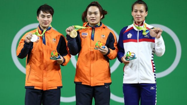 AUGUST 08: (L-R) Silver medalist Pimsiri Sirikaew of Thailand, gold medalist Sukanya Srisurat of Thailand and bronze medalist Hsing-Chun Kuo of Chinese Taipei pose on the podium during the medal ceremony for the Women's 58kg Group A weightlifting contest the on Day 3 of the Rio 2016 Olympic Games